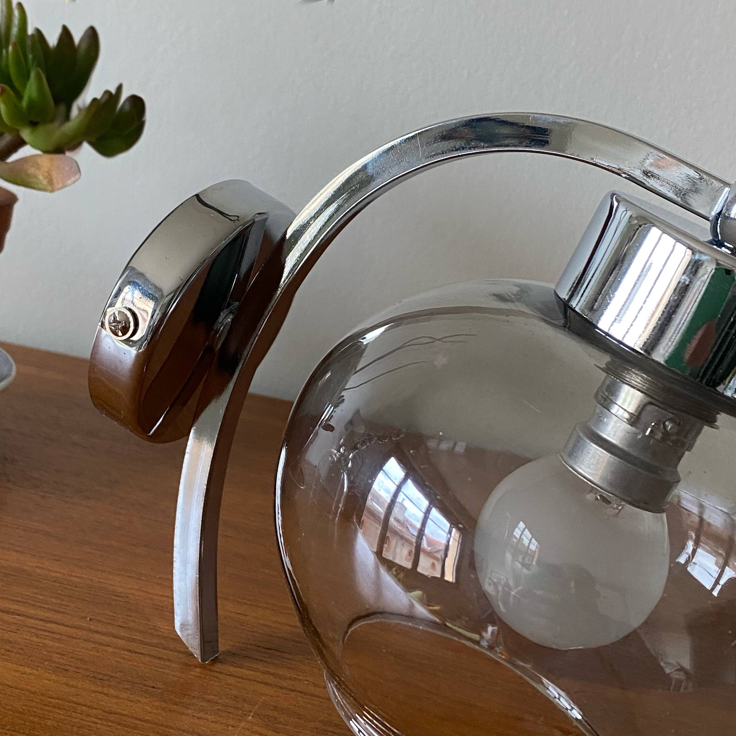 Wall light in chromed metal and smoked grey glass globe