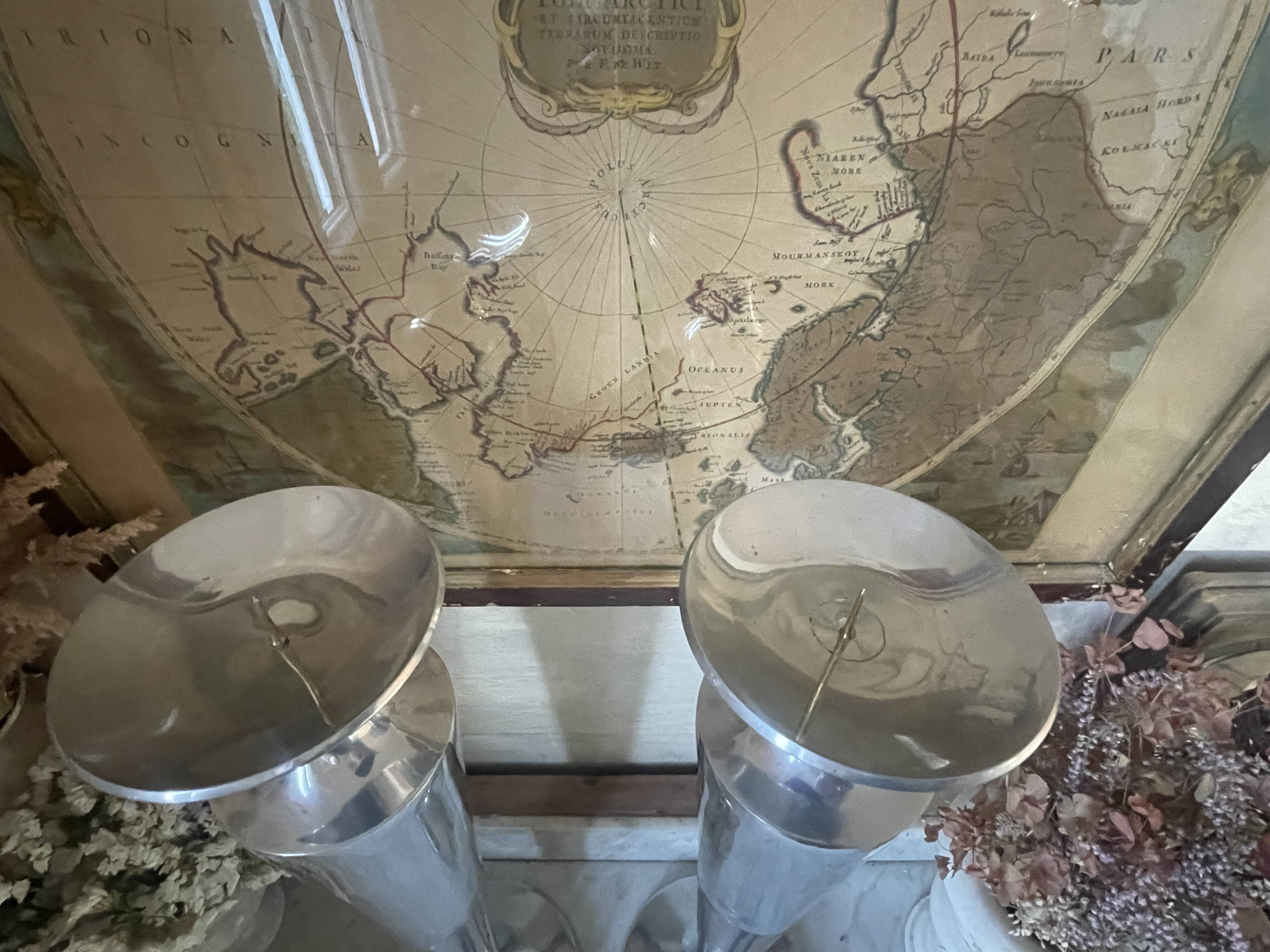 Pair of aluminium cast candle holders 52cm