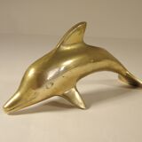 Three brass dolphins
