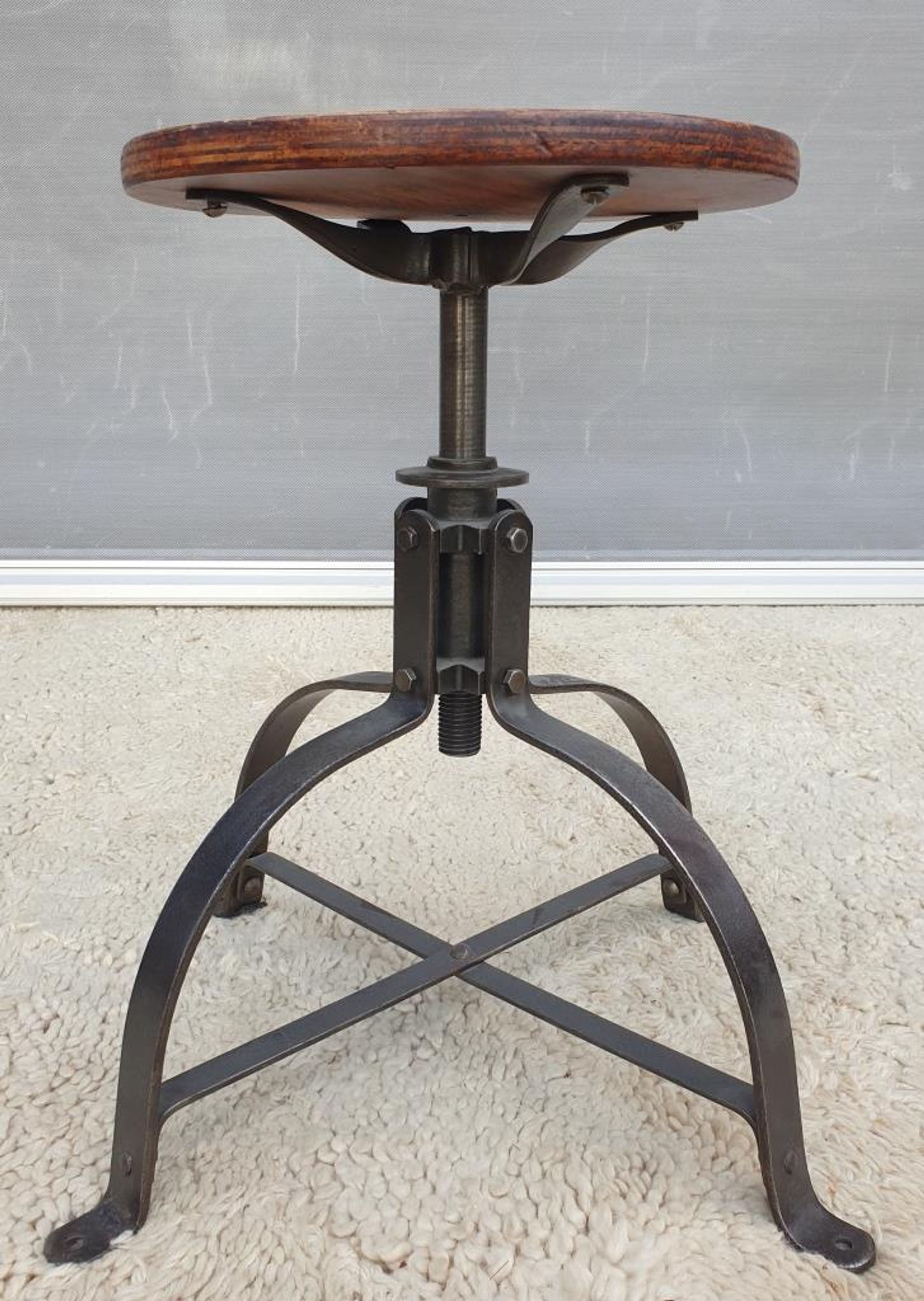 Bienaise stool of the years 1935, model 203 with 4 flat iron cathedral legs joined by a