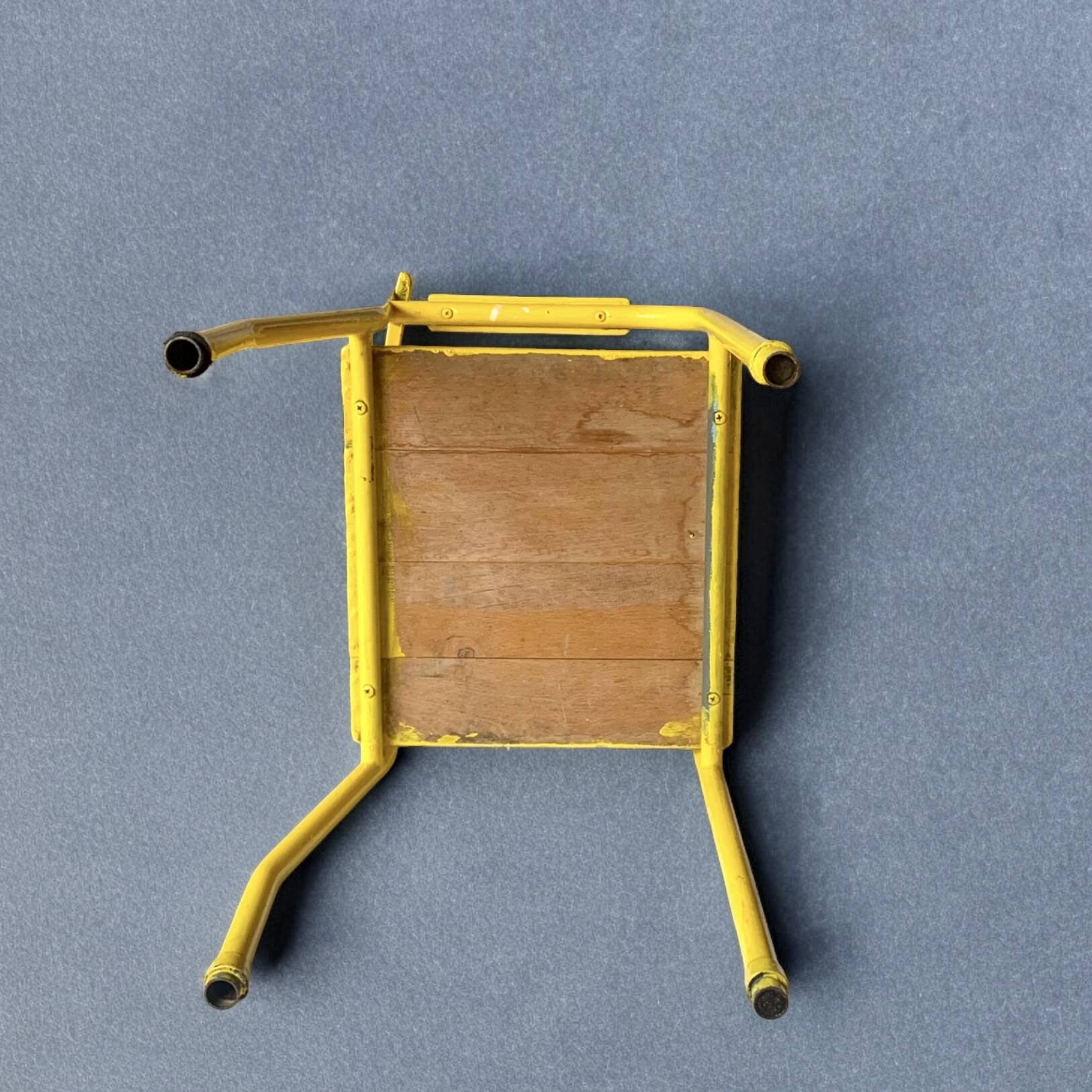 Vintage children's chair in yellow painted wood and metal