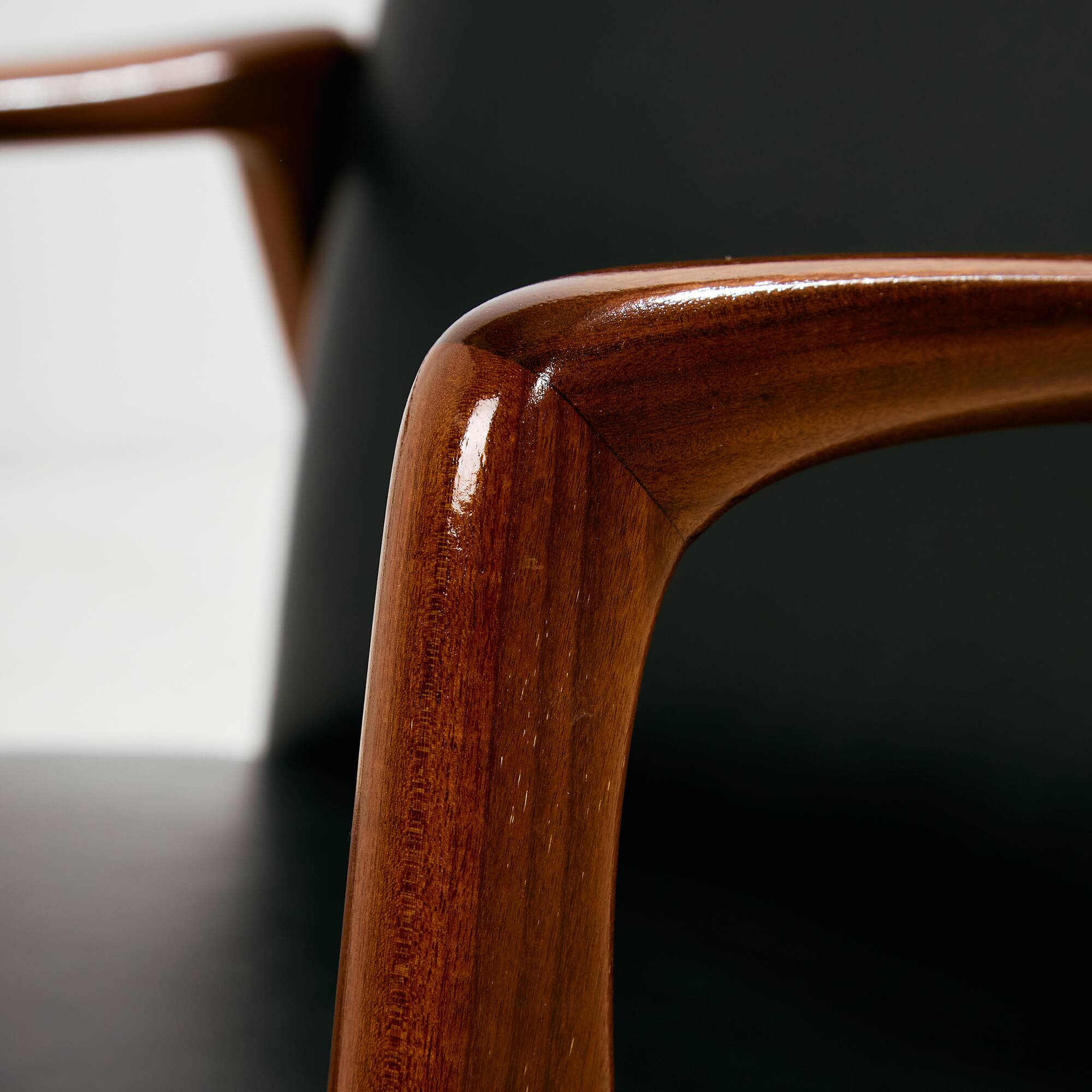 Teak armchair with leather upholstery