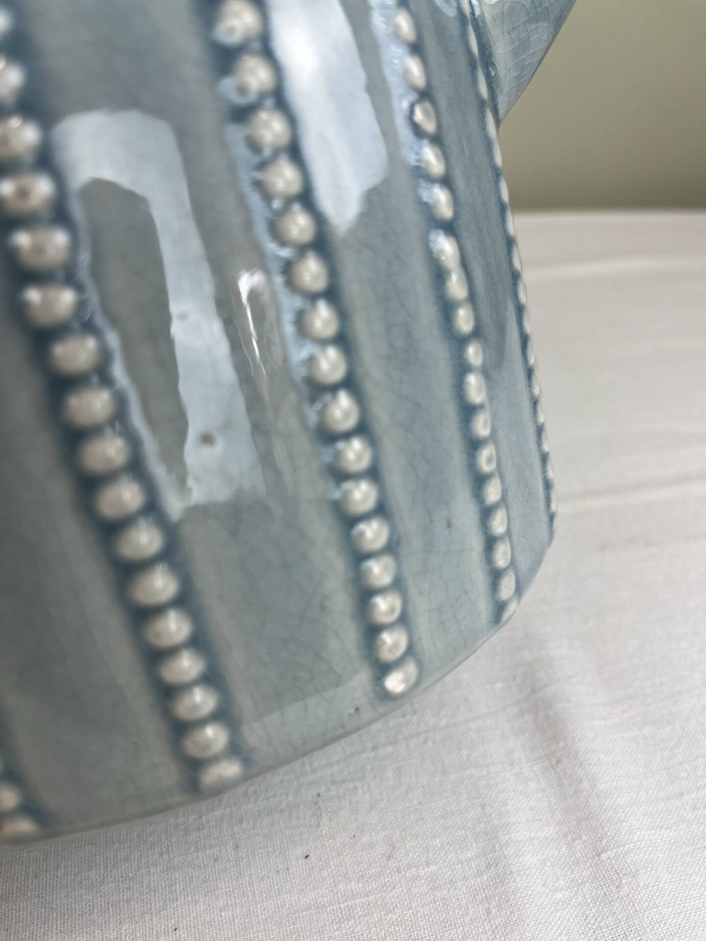 Large vintage pitcher in crackled celadon ceramic, beaded decoration.
