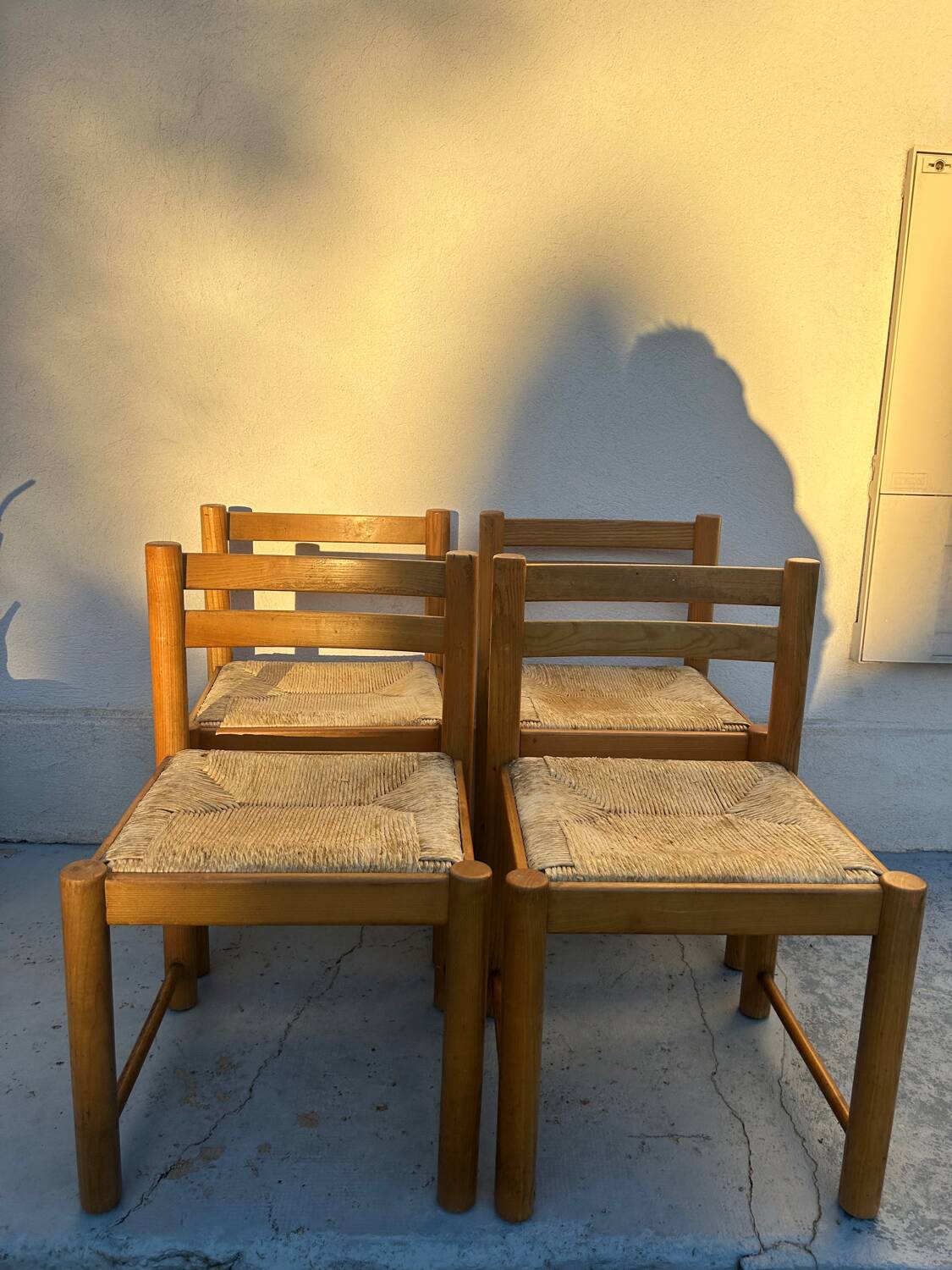 4 vintage chairs made of solid wood and woven straw