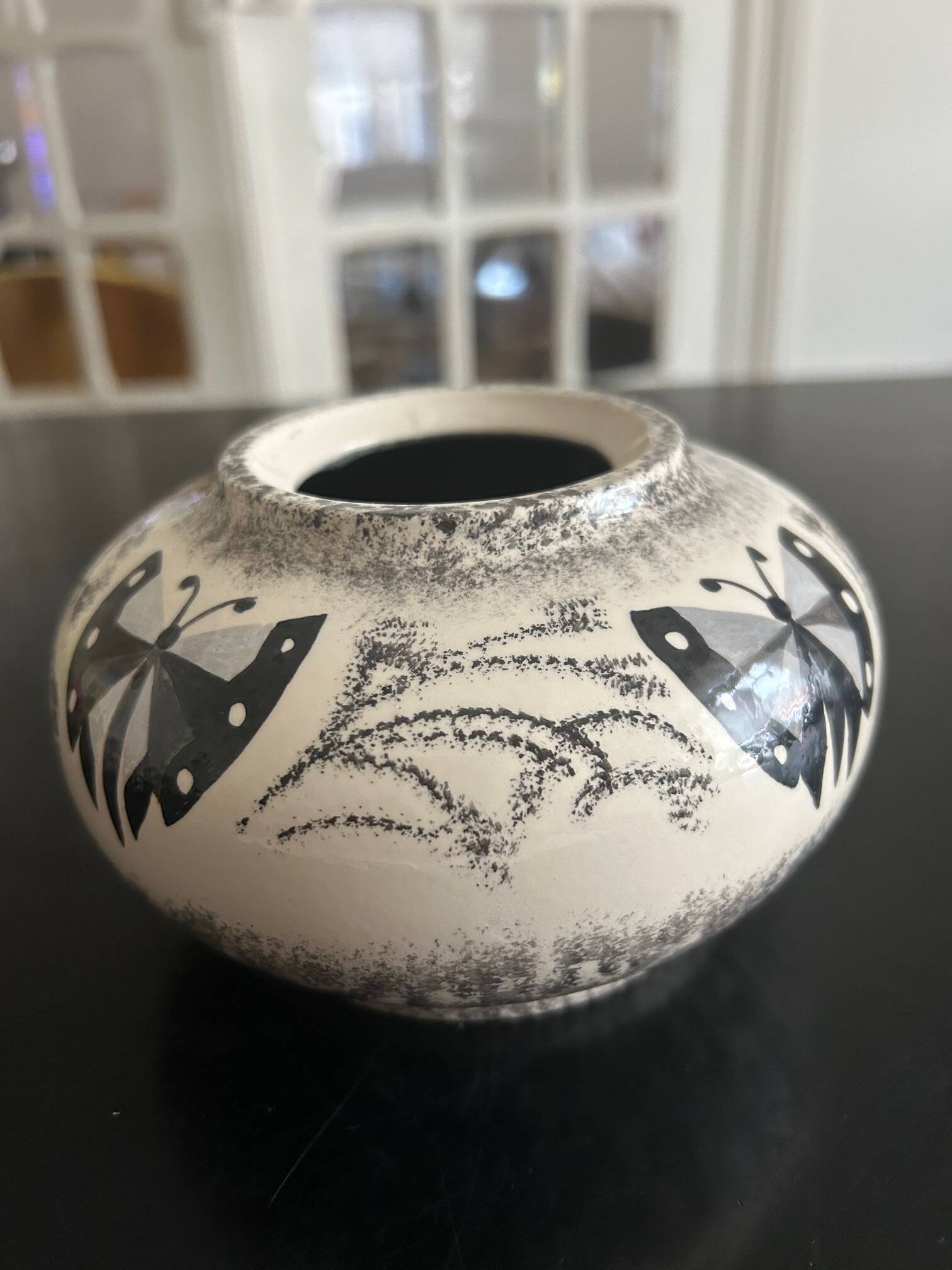 ceramic vase decorated by the artist René Poirot
