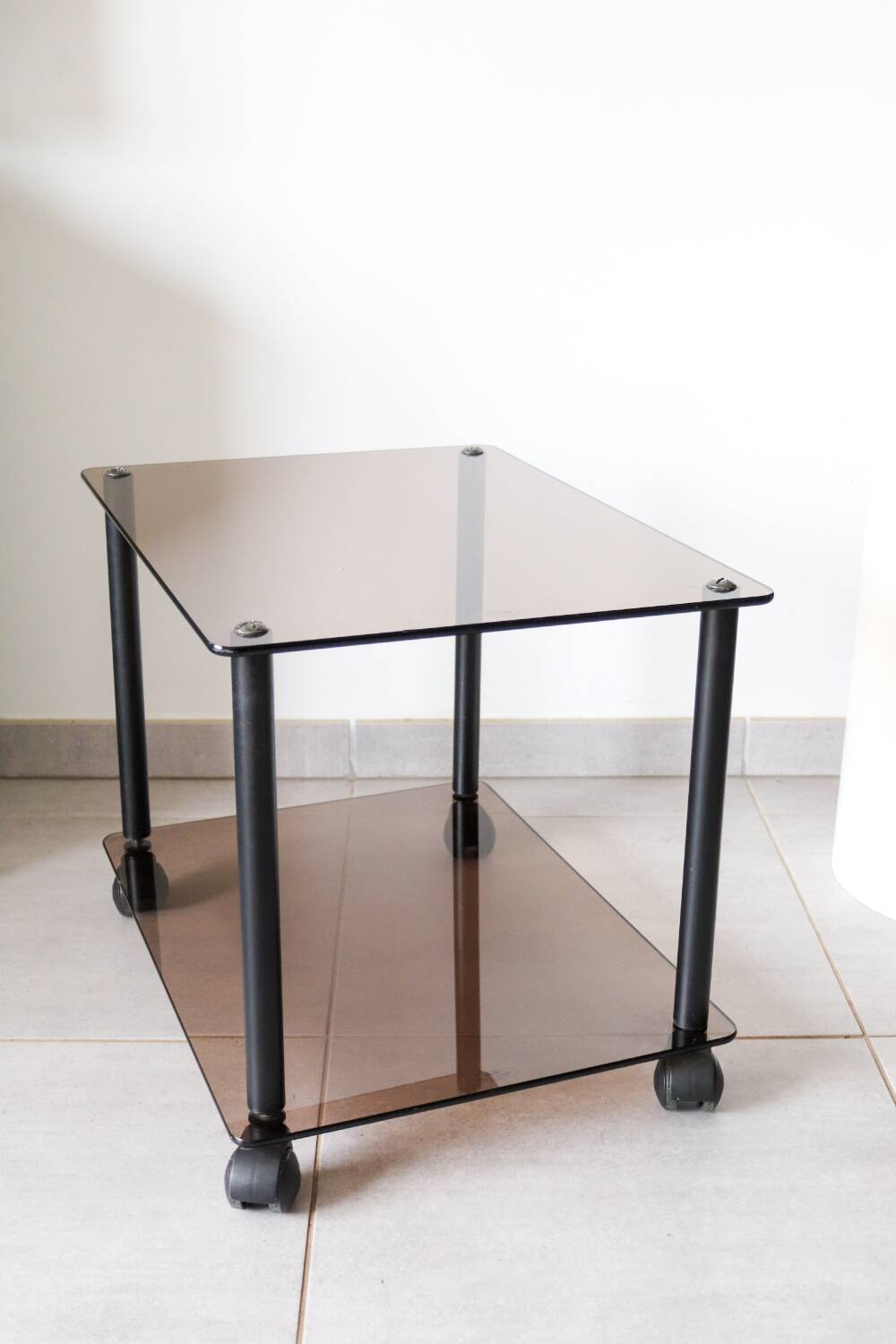 Erard tempered glass coffee table on wheels