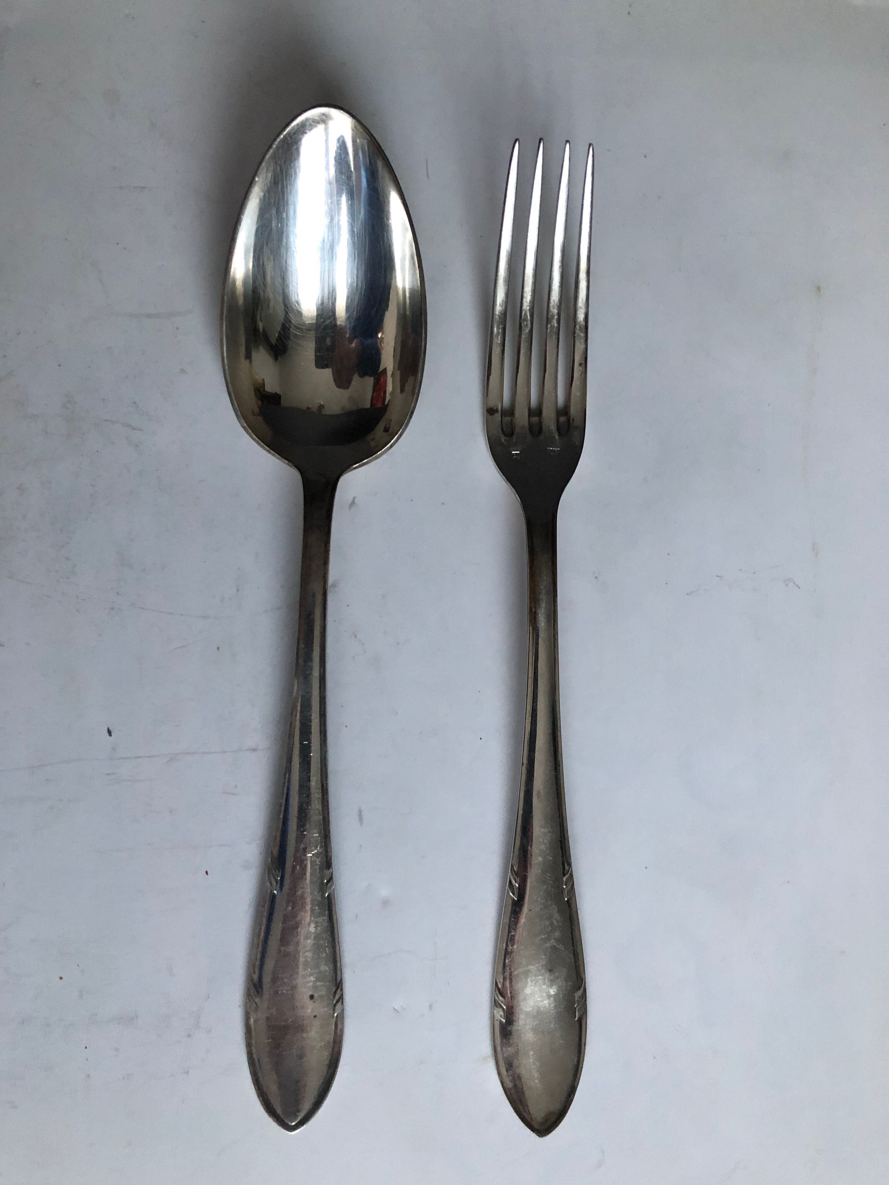 Set of twelve silver metal cutlery (24 pieces)