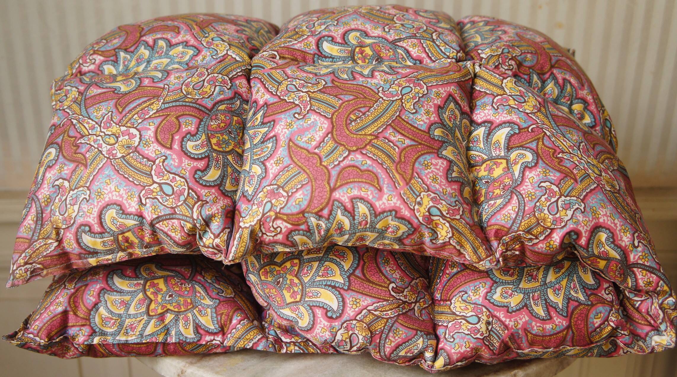 Small quilt filled with paisley pattern feathers