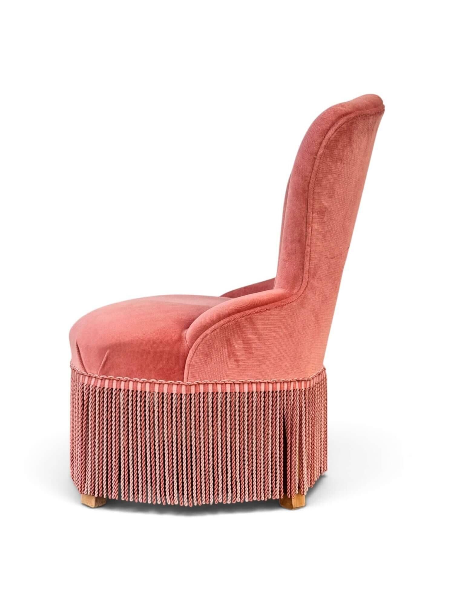 Vintage pink velvet fringed armchair