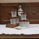 Six pressed glass whisky glasses with red and gold rims