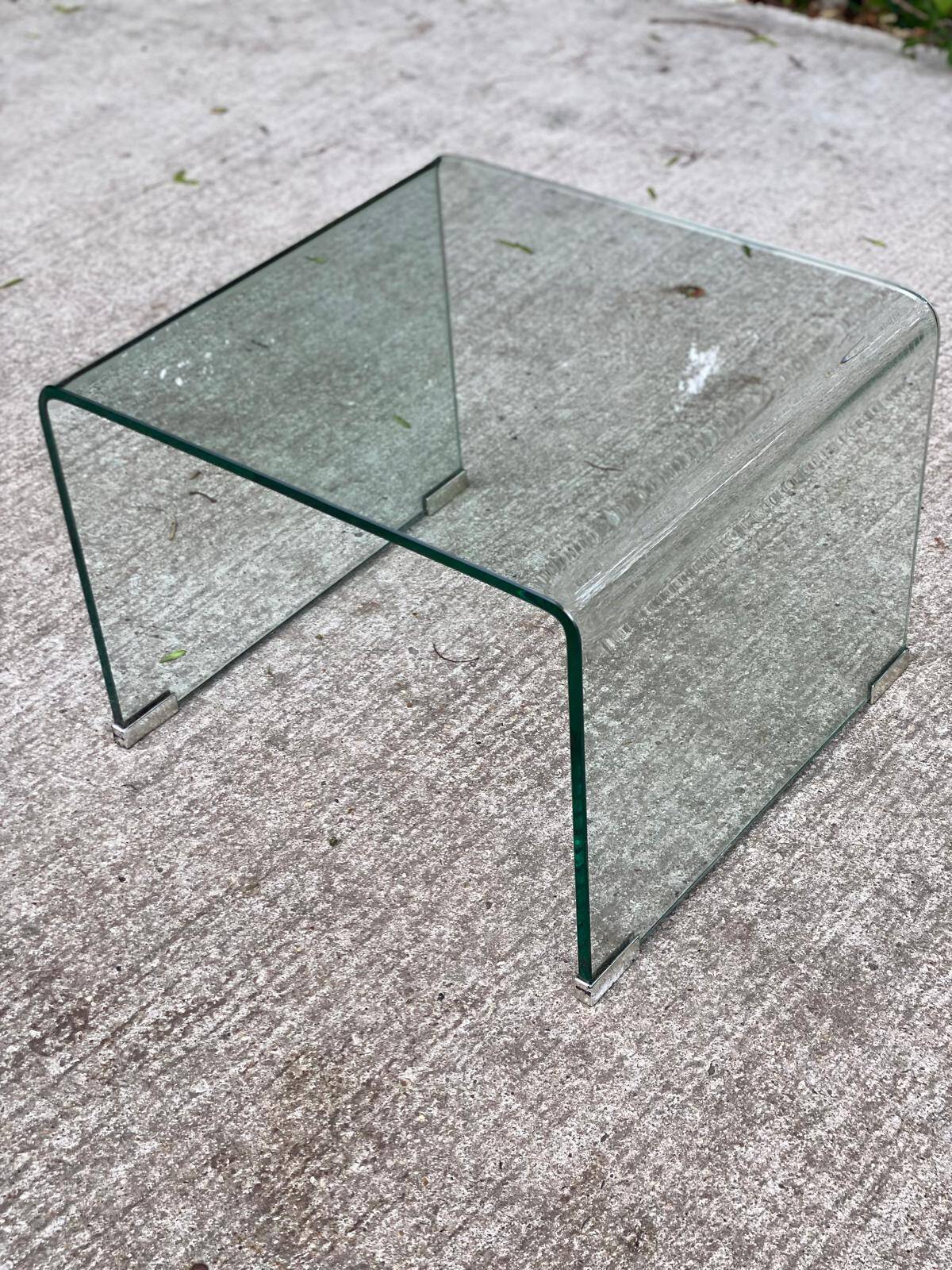 Vintage Italian coffee table with curved glass from the 1980s.