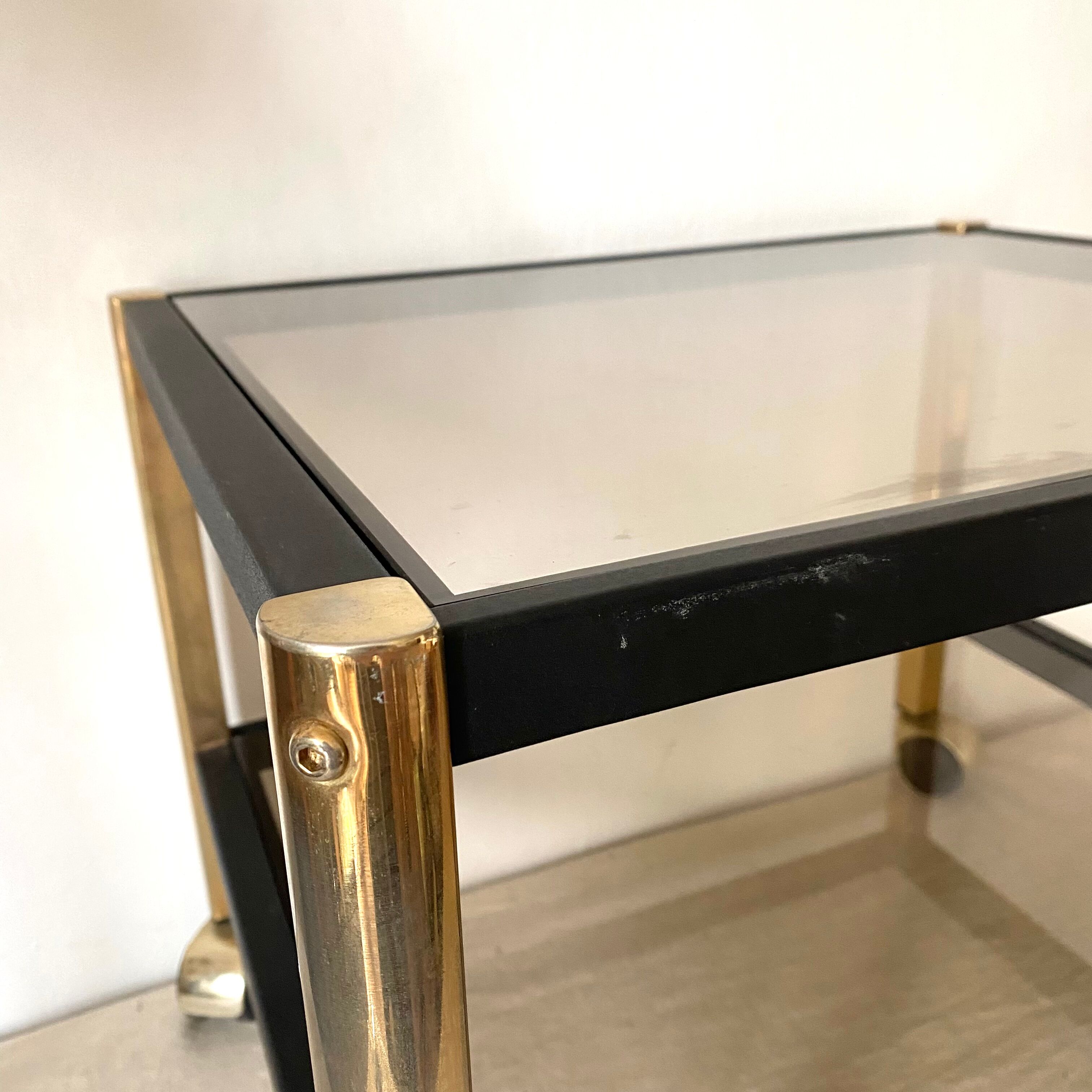 Serving with vintage wheels in metal and smoked glass