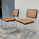 Pair of chairs by Marcel Breuer in black canework model B32 signed Italy