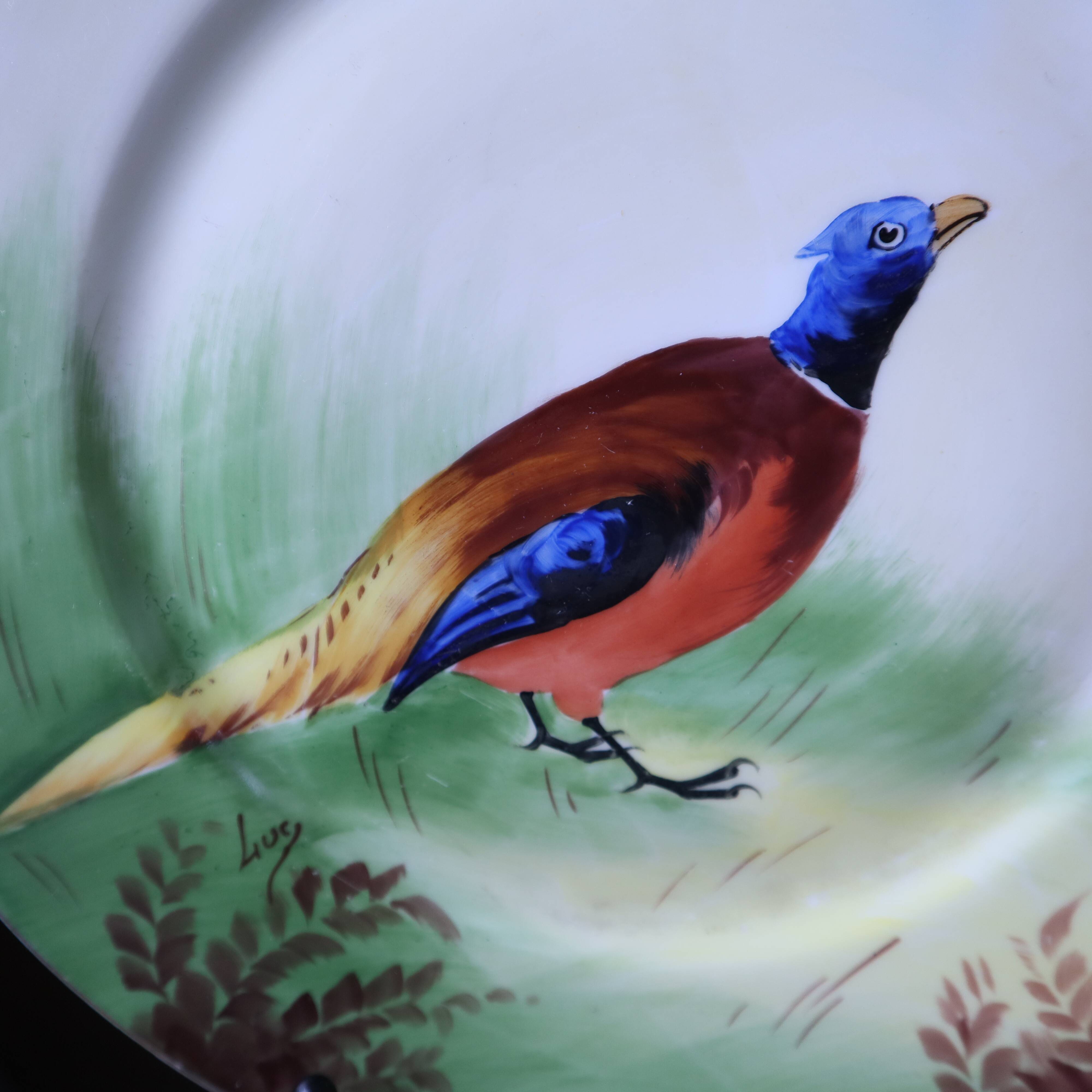3 decorative porcelain plates from Limoges featuring partridges and pheasants.