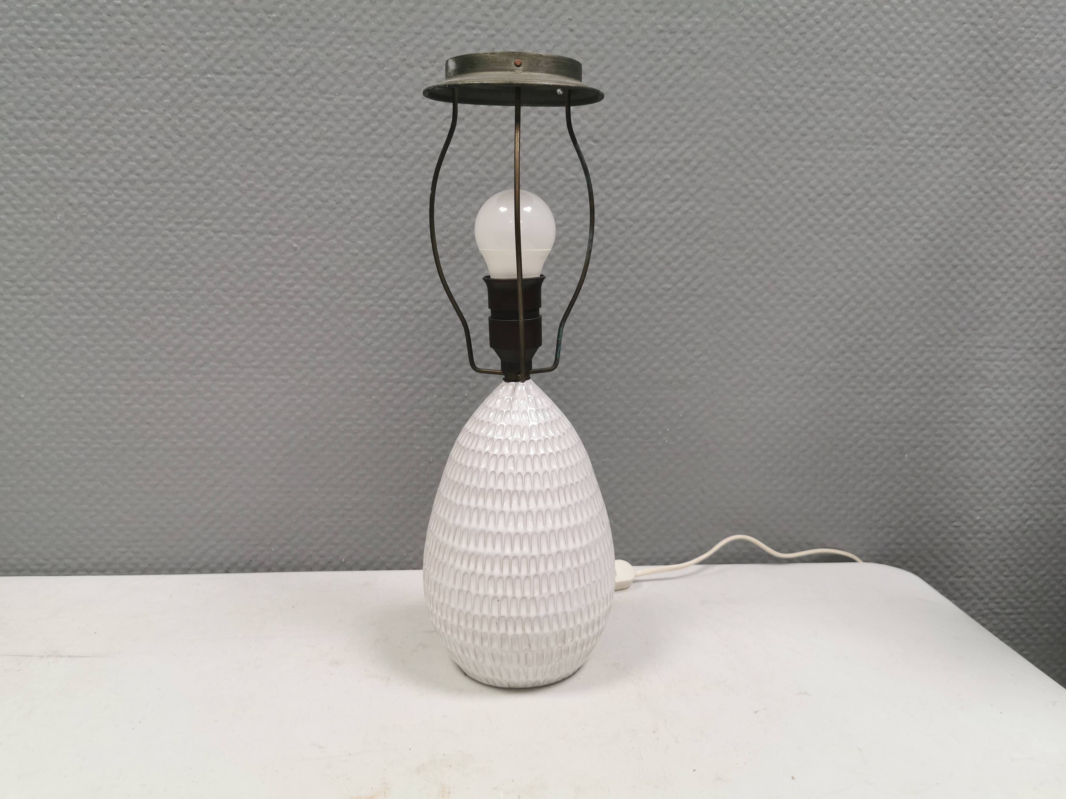 Older ceramic table lamp with beautiful details.