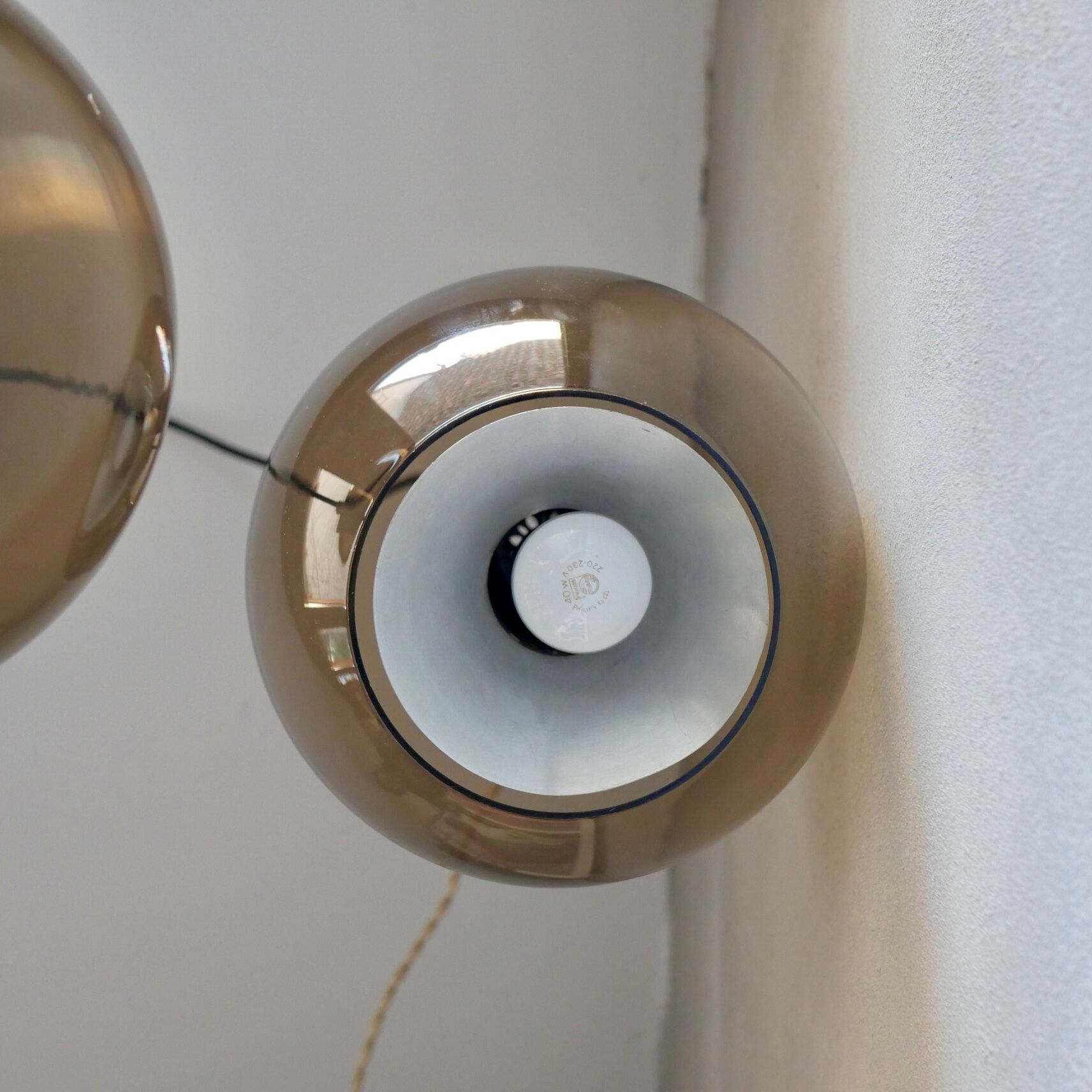 Pair of raak Amsterdam globe suspensions