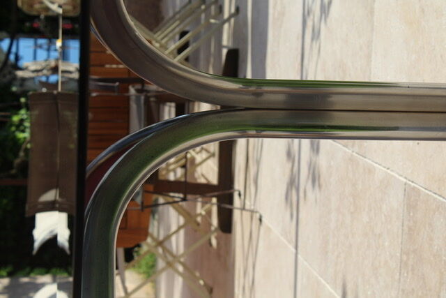Oval glass and stainless steel table 70s