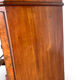 A pair of antique walnut bedside tables from the 1890s.