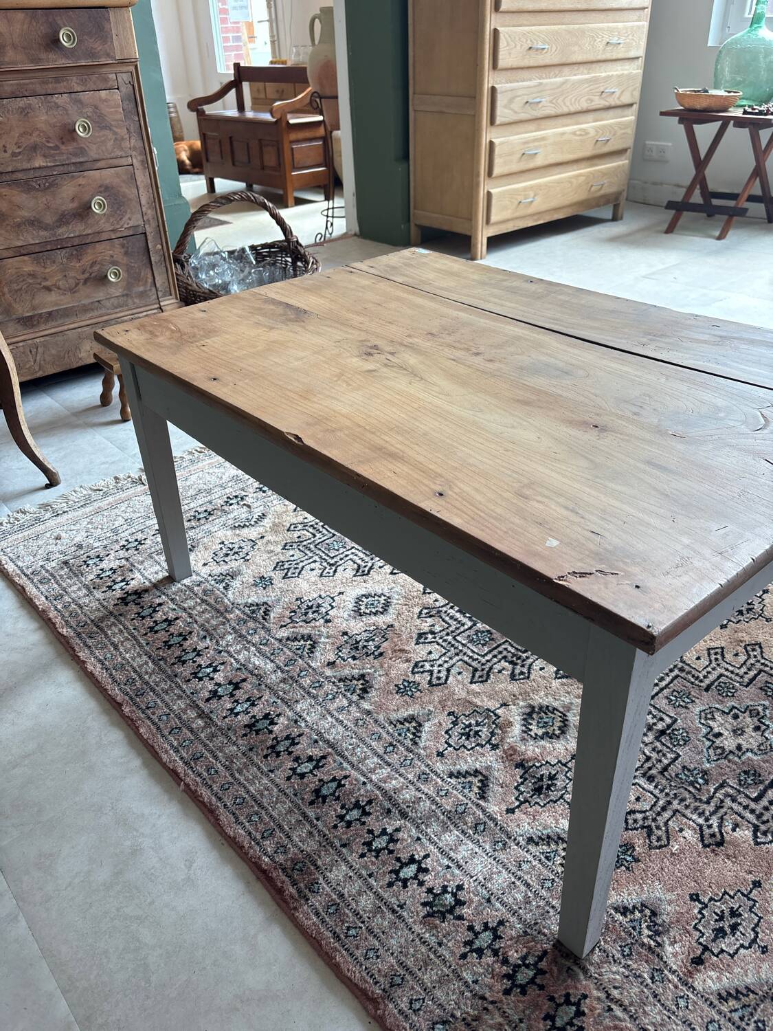 Coffee table with sandblasted top and painted legs.