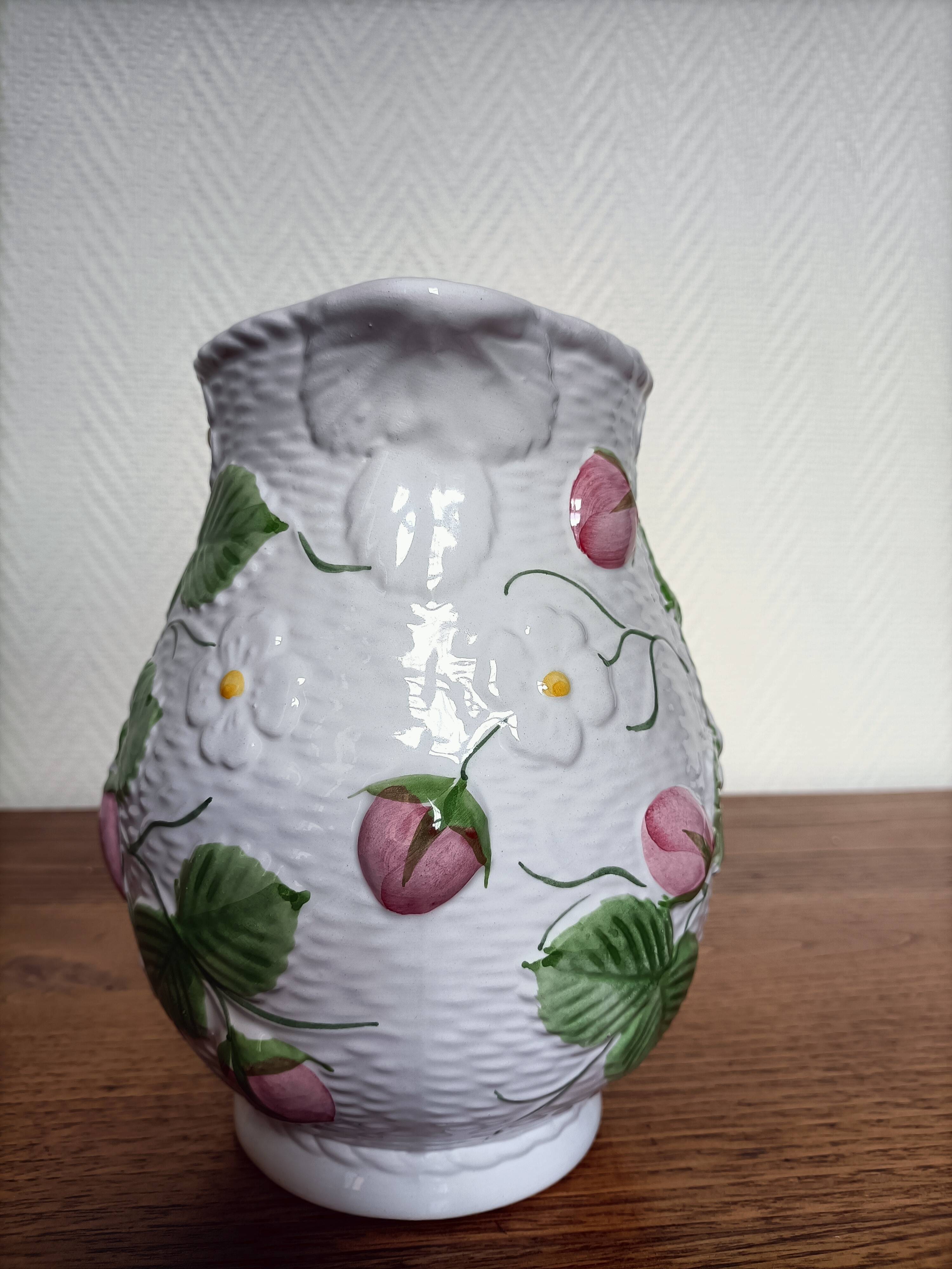 Barbotine pitcher with pastel flower decoration