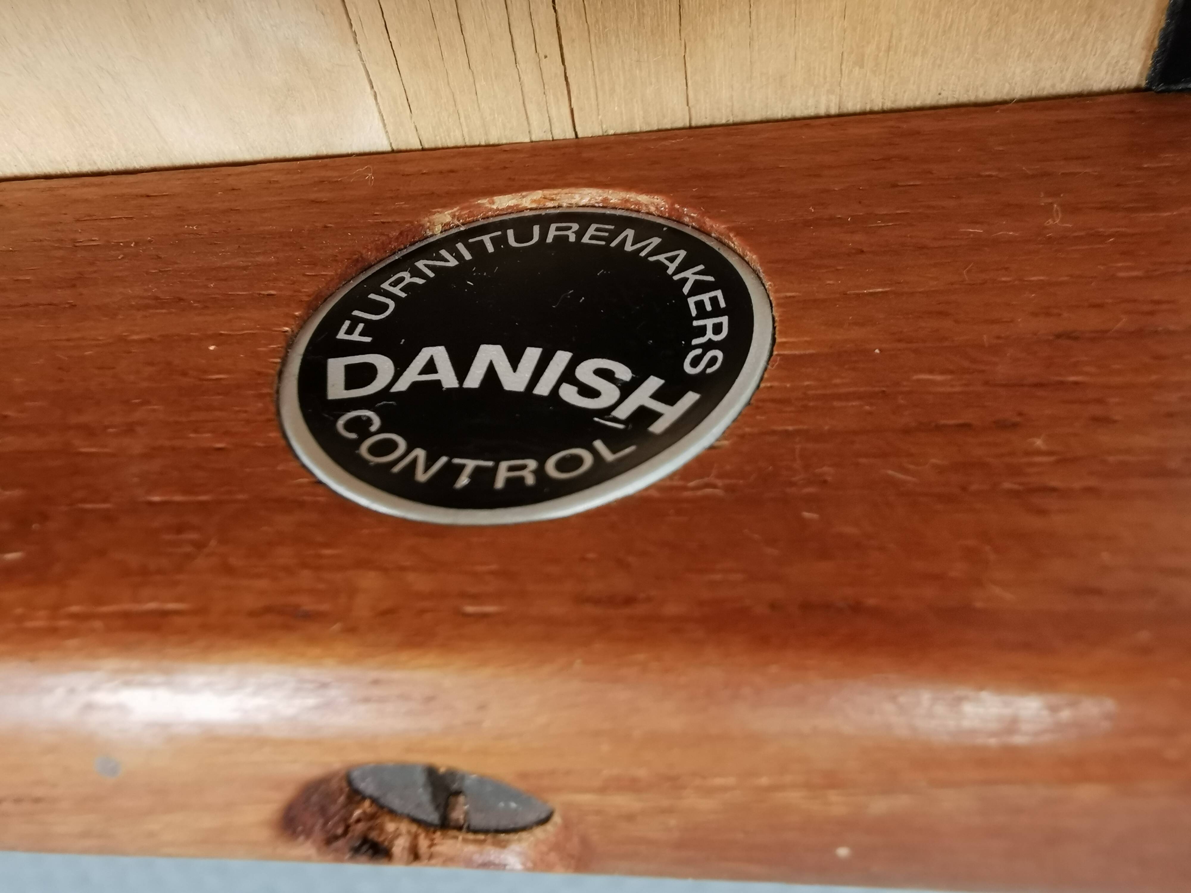 Danish designed footstool in teak wood and black skai “imitation leather”