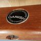 Danish designed footstool in teak wood and black skai “imitation leather”