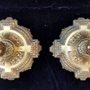 Pair of antique carved bronze candlesticks.