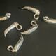 Set of 6 silver metal knife holders for table