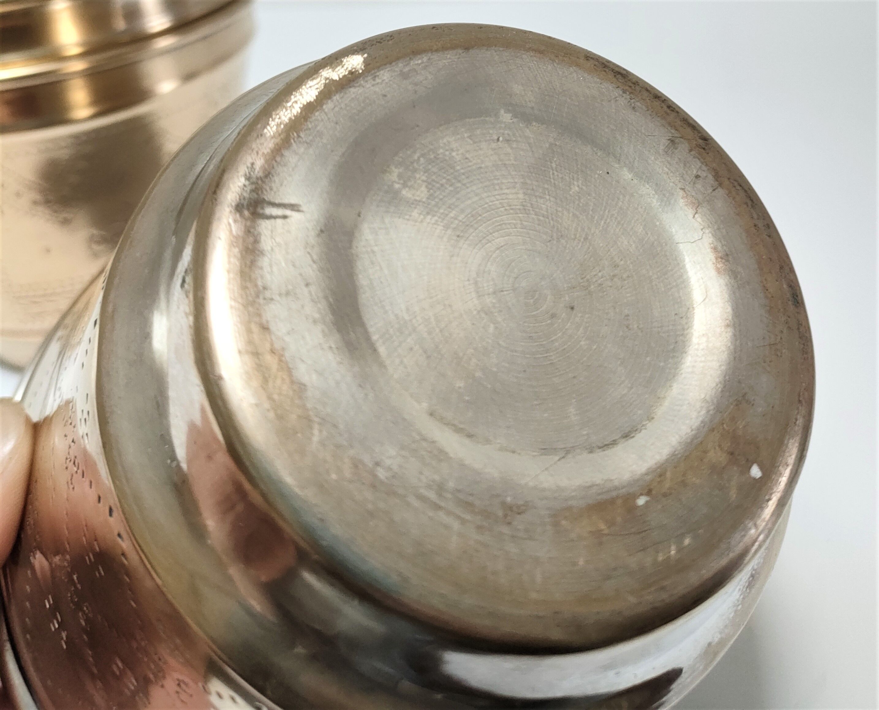Three pot covers brass silver cover golden patina monogram early twentieth century