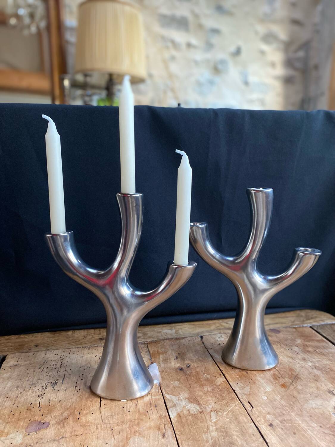 Silver candlesticks in the shape of a 3-branch tree