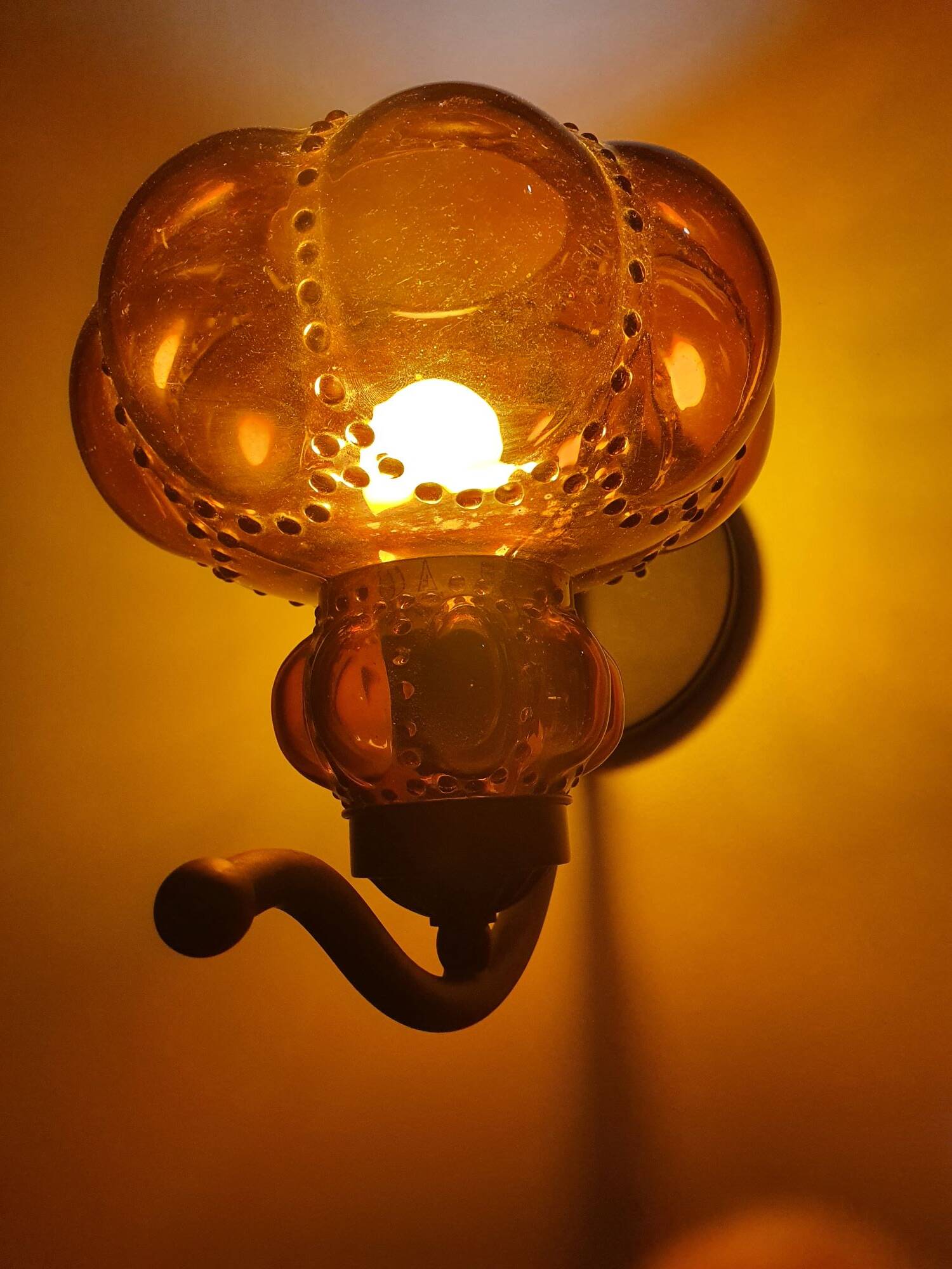 Three large vintage brown glass wall lights