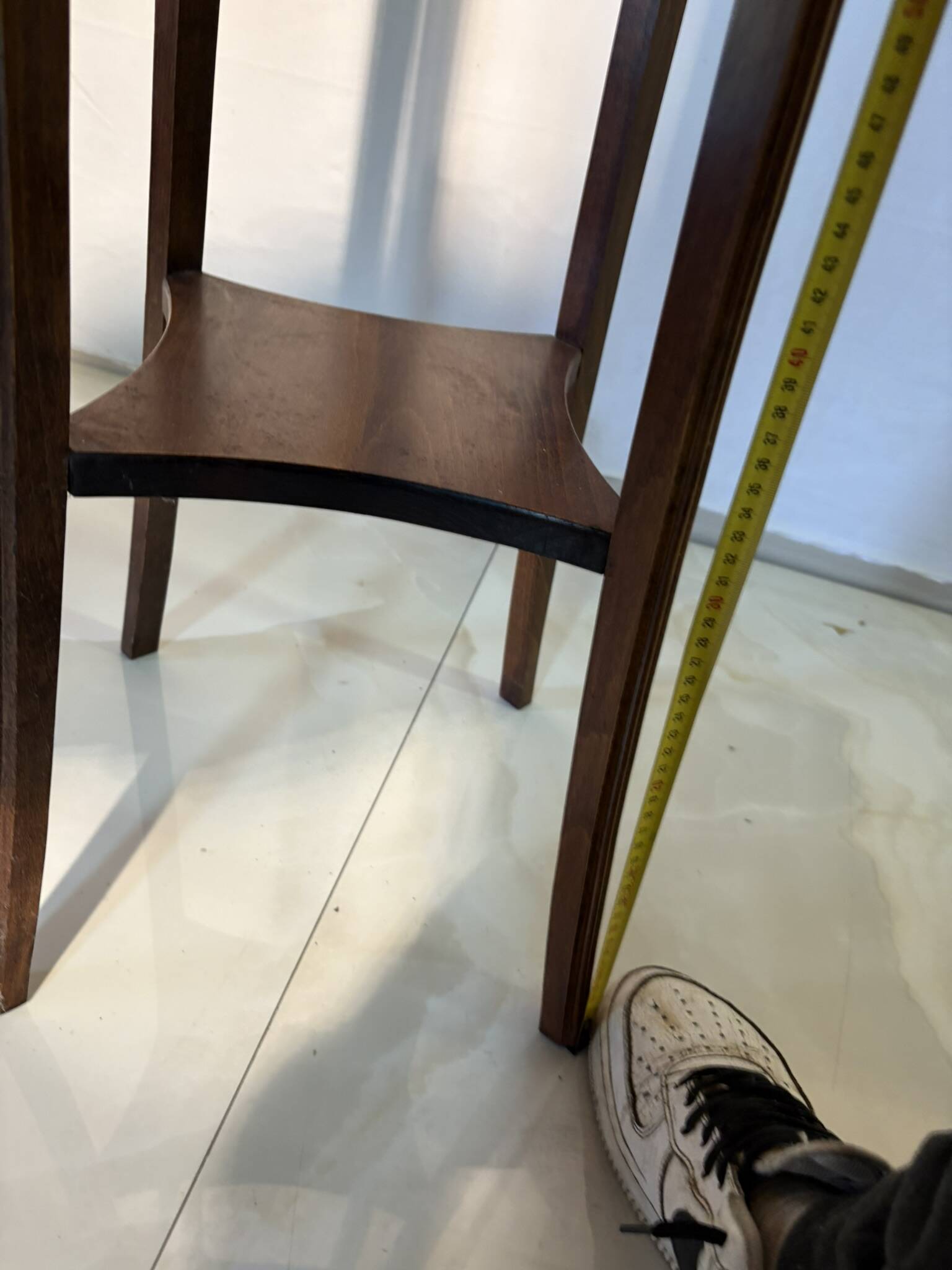 Vintage dark wood side table with curved base