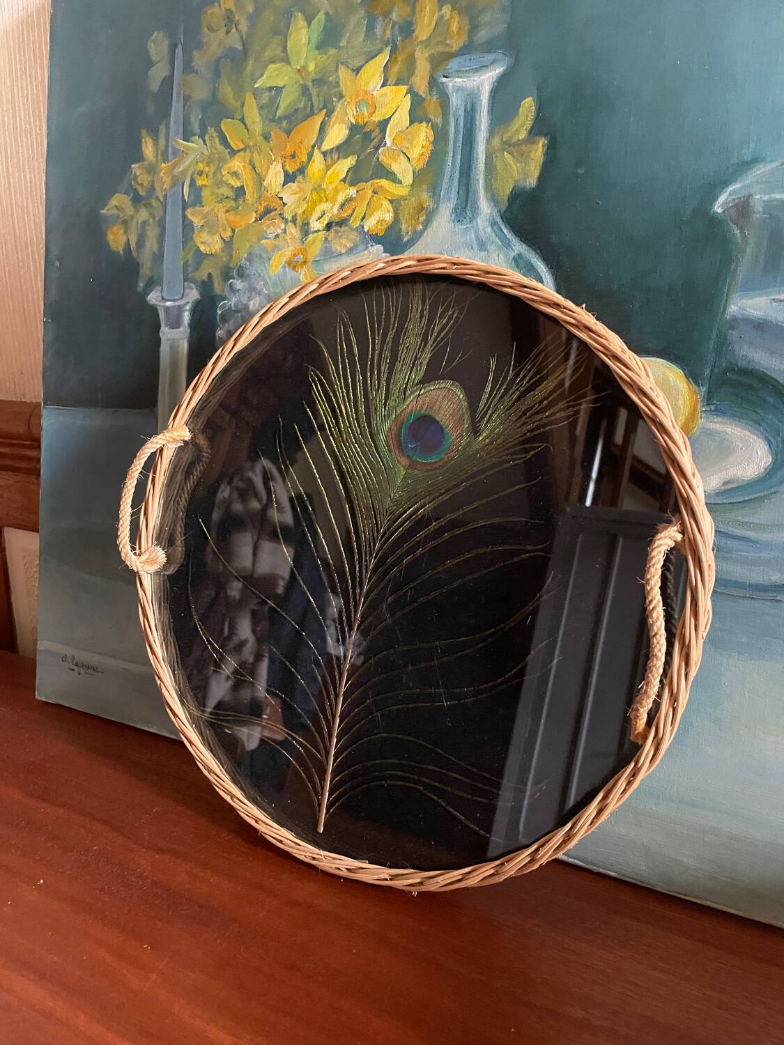 Vintage rattan tray with peacock feather