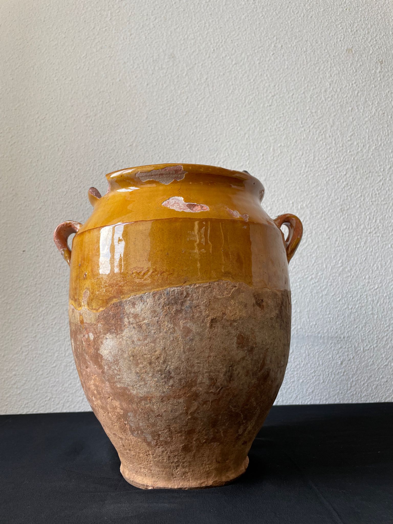 Old grease pot in glazed yellow terracotta, France nineteenth century