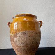 Old grease pot in glazed yellow terracotta, France nineteenth century