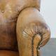 Fauteuil ancien en cuir de mouton
