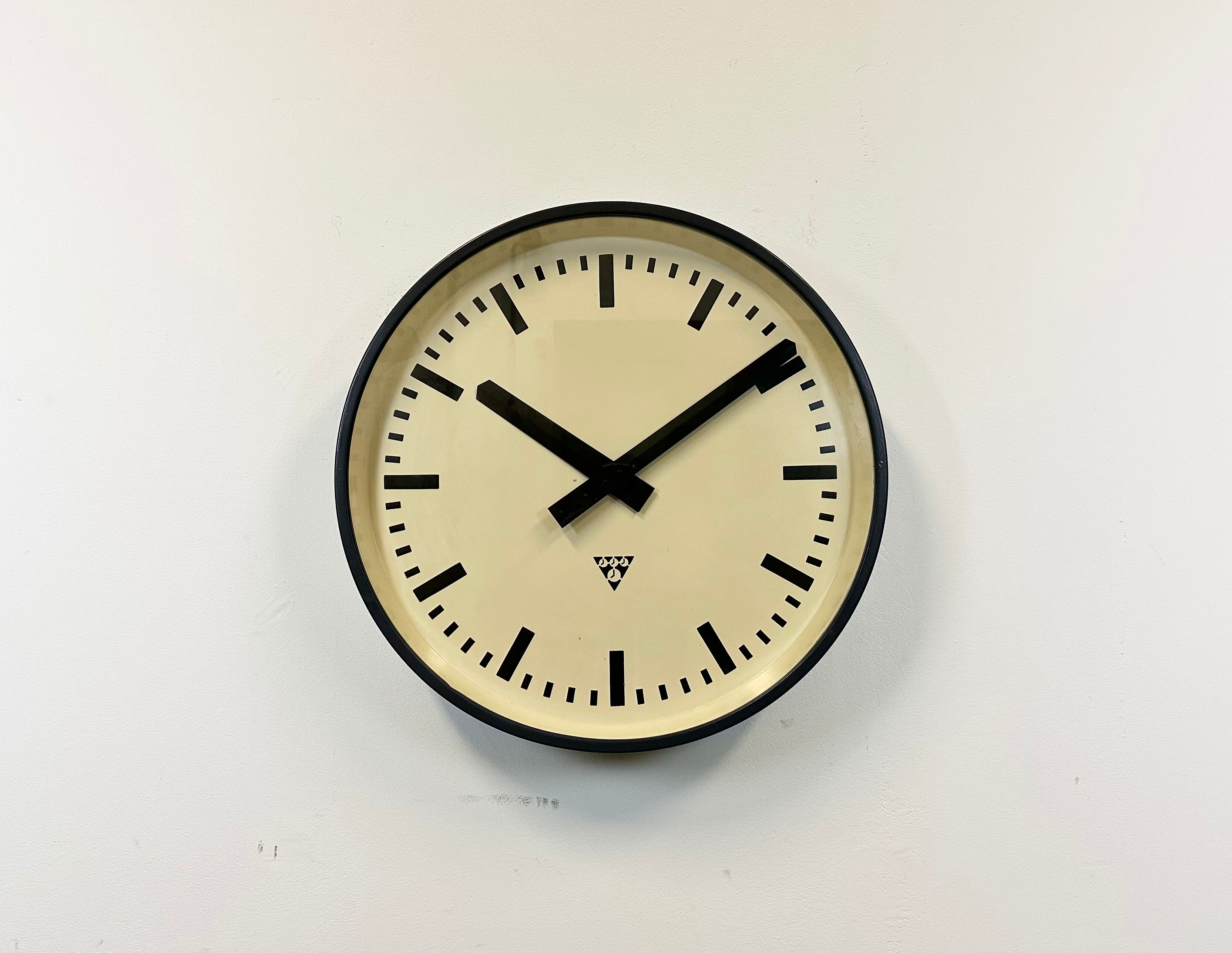 Grey industrial factory wall clock from pragotron, 1960s