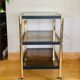 Side table in gold metal and smoked glasses 1970s