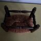 Turned wooden stool and straw