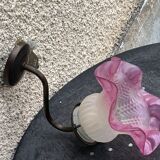 Metal wall lamp with frosted glass shade in the shape of a pink corolla