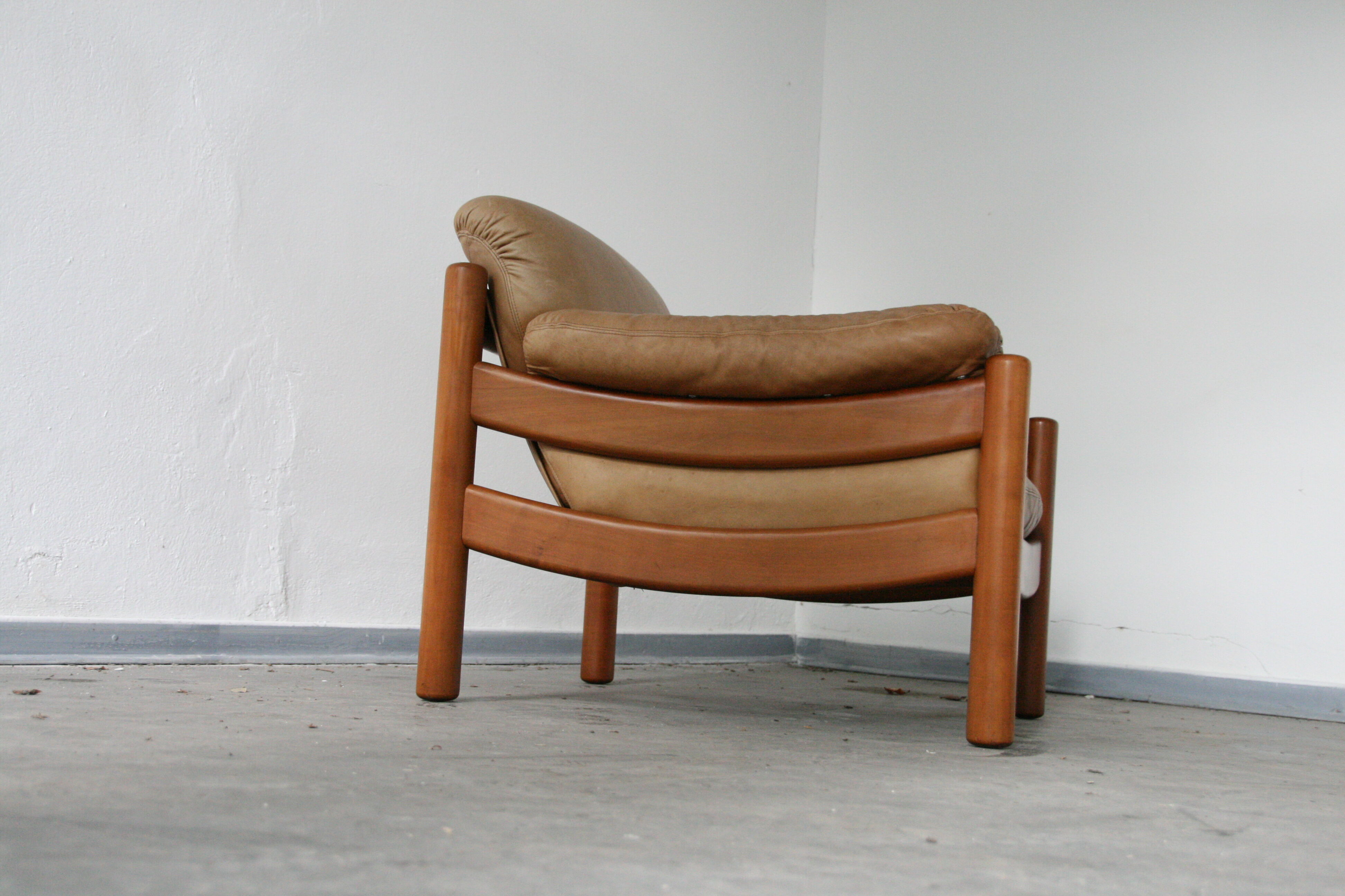 Teak and leather club armchairs
