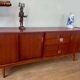 Scandinavian teak sideboard, 230 cm long, with 3 doors and 4 drawers.