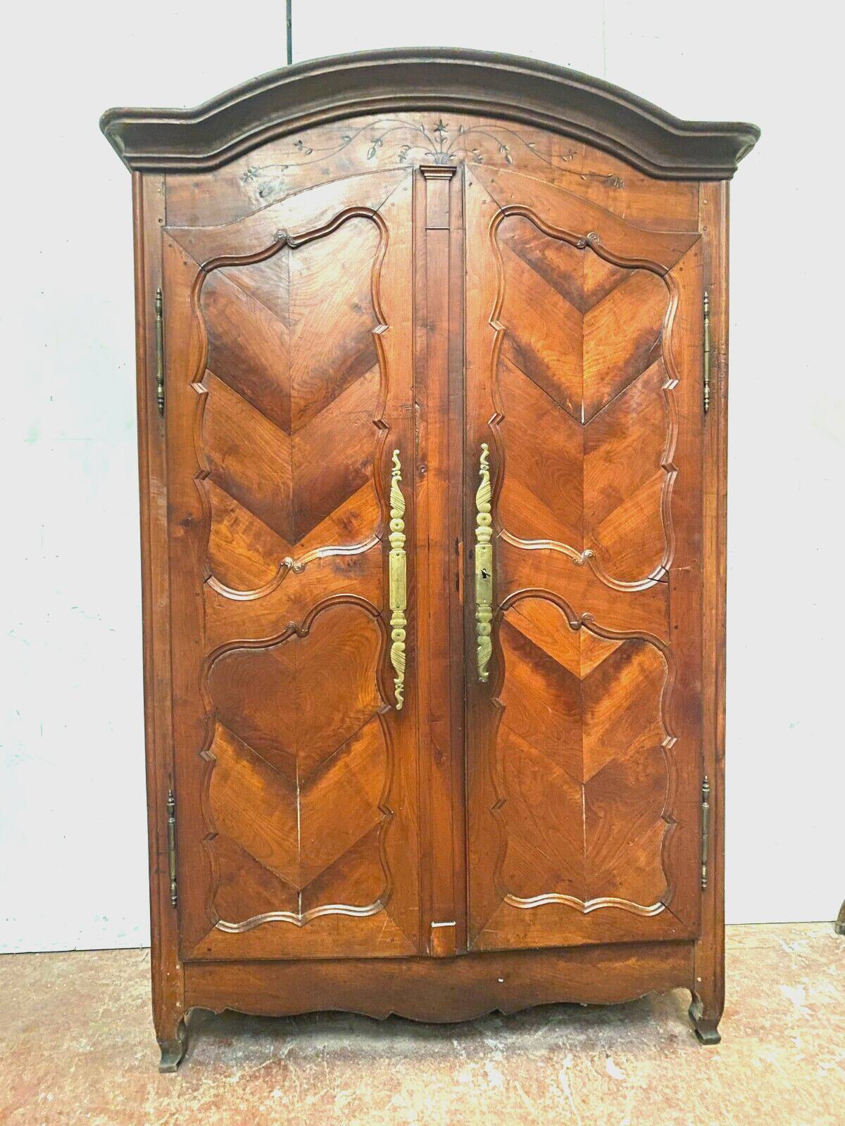 Louis XV armoire with gendarme's hat in solid cherry wood, 18th century