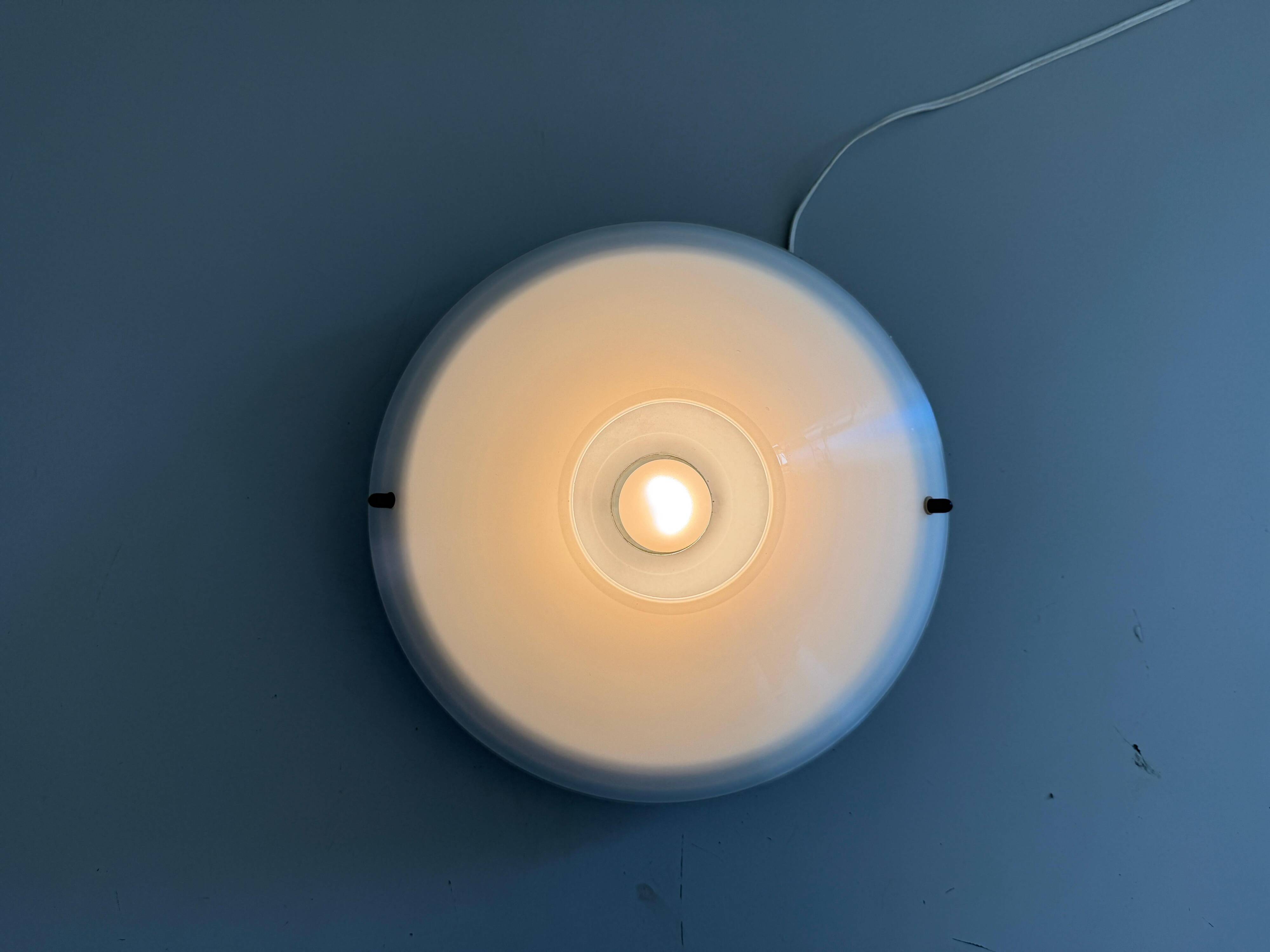Simple opal glass wall light from the mid-century by Lamperti, 1960s, Italy.