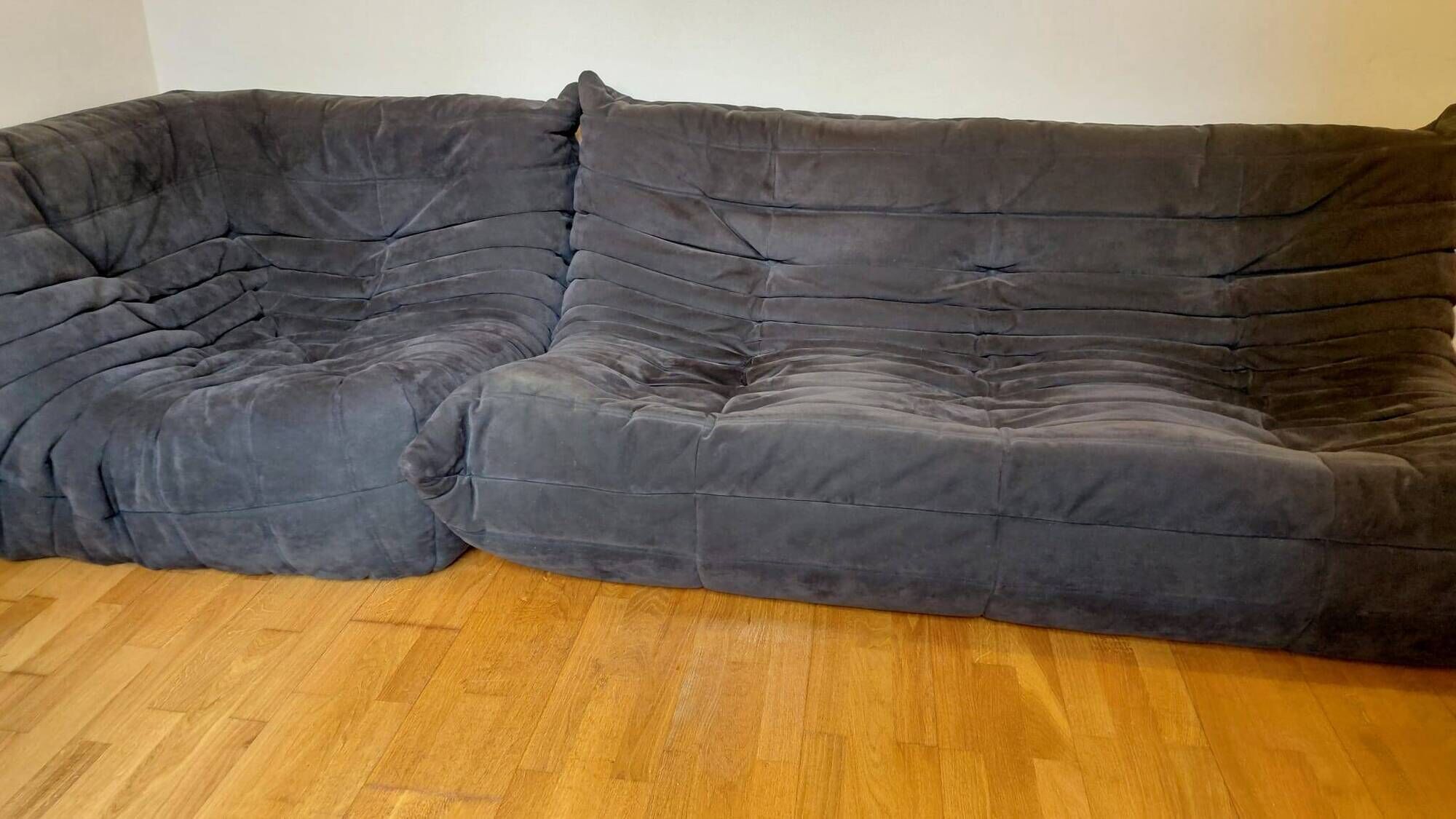 Togo Set by Ligne Roset, 3-seater sofa, corner piece and armchair in grey alcantara.