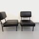 Set of 2 vintage modernist armchairs in black faux leather and metal.