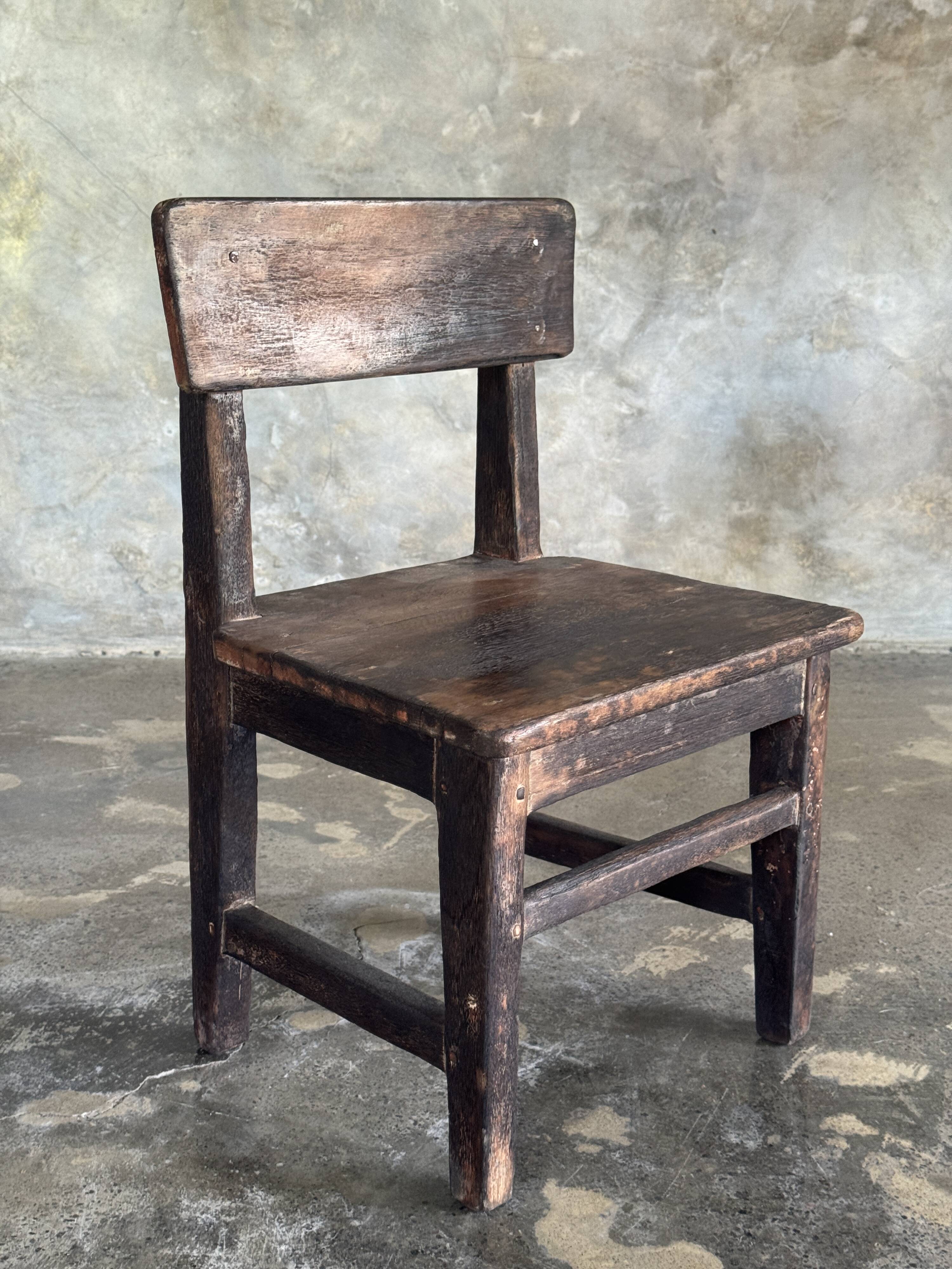 Small antique Indonesian children's chair in teak.