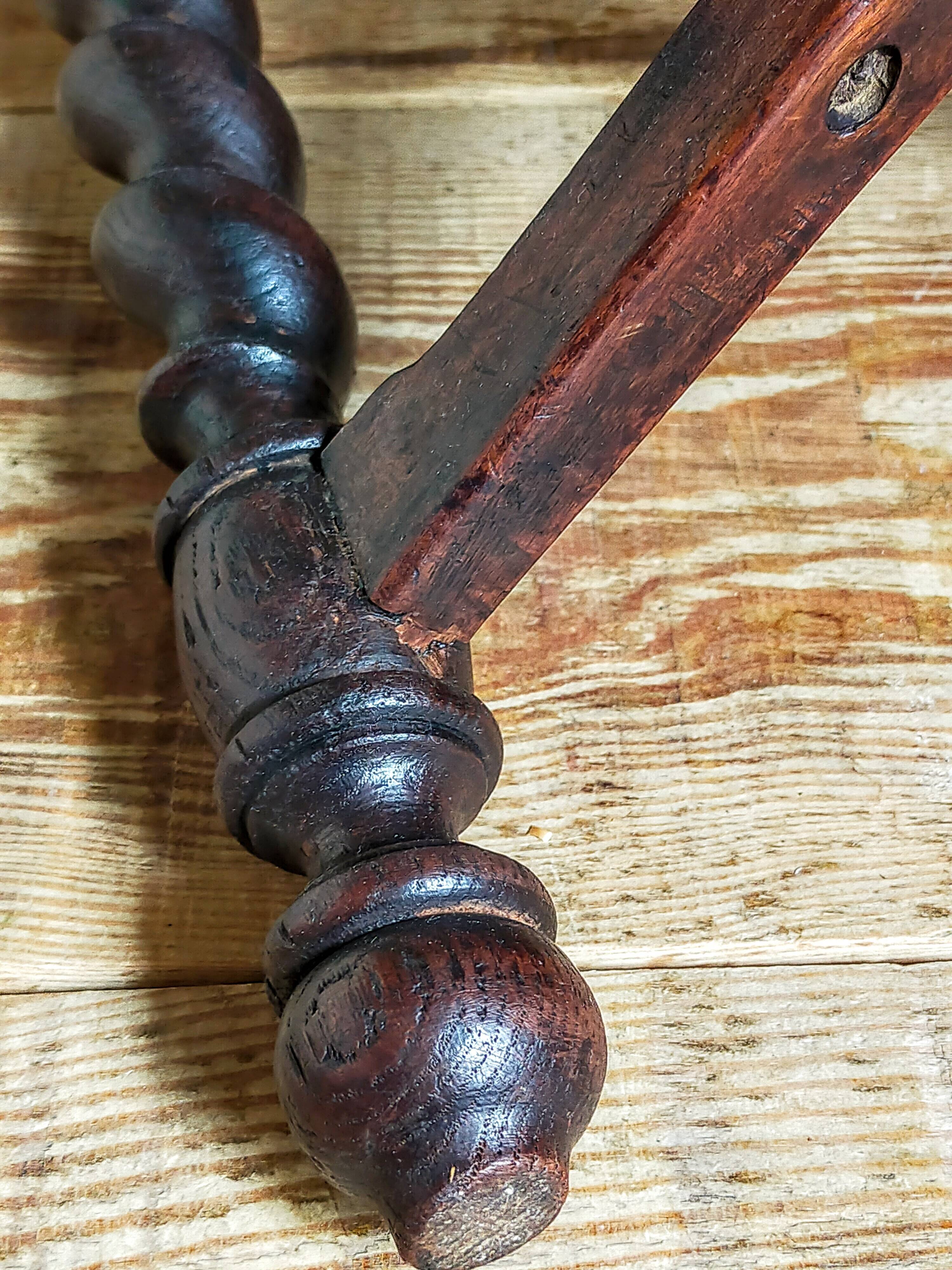Antique stool in turned and carved solid wood
