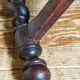 Antique stool in turned and carved solid wood