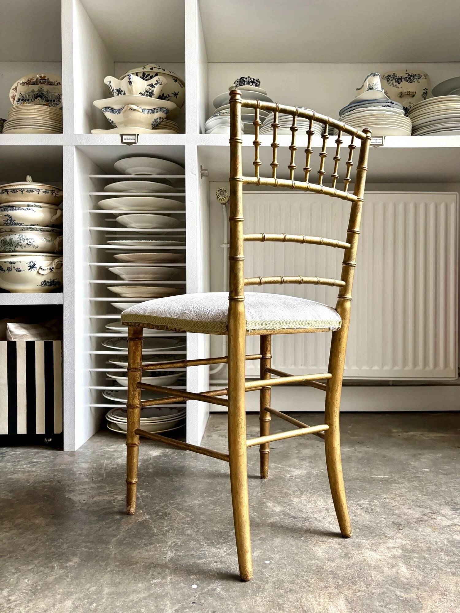 Napoleon III chair in gilded bamboo wood and beige cotton.